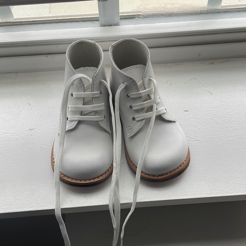 Walking shoes only worn once. Hard bottoms.